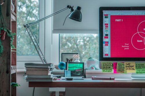 black desk lamp on white wooden desk